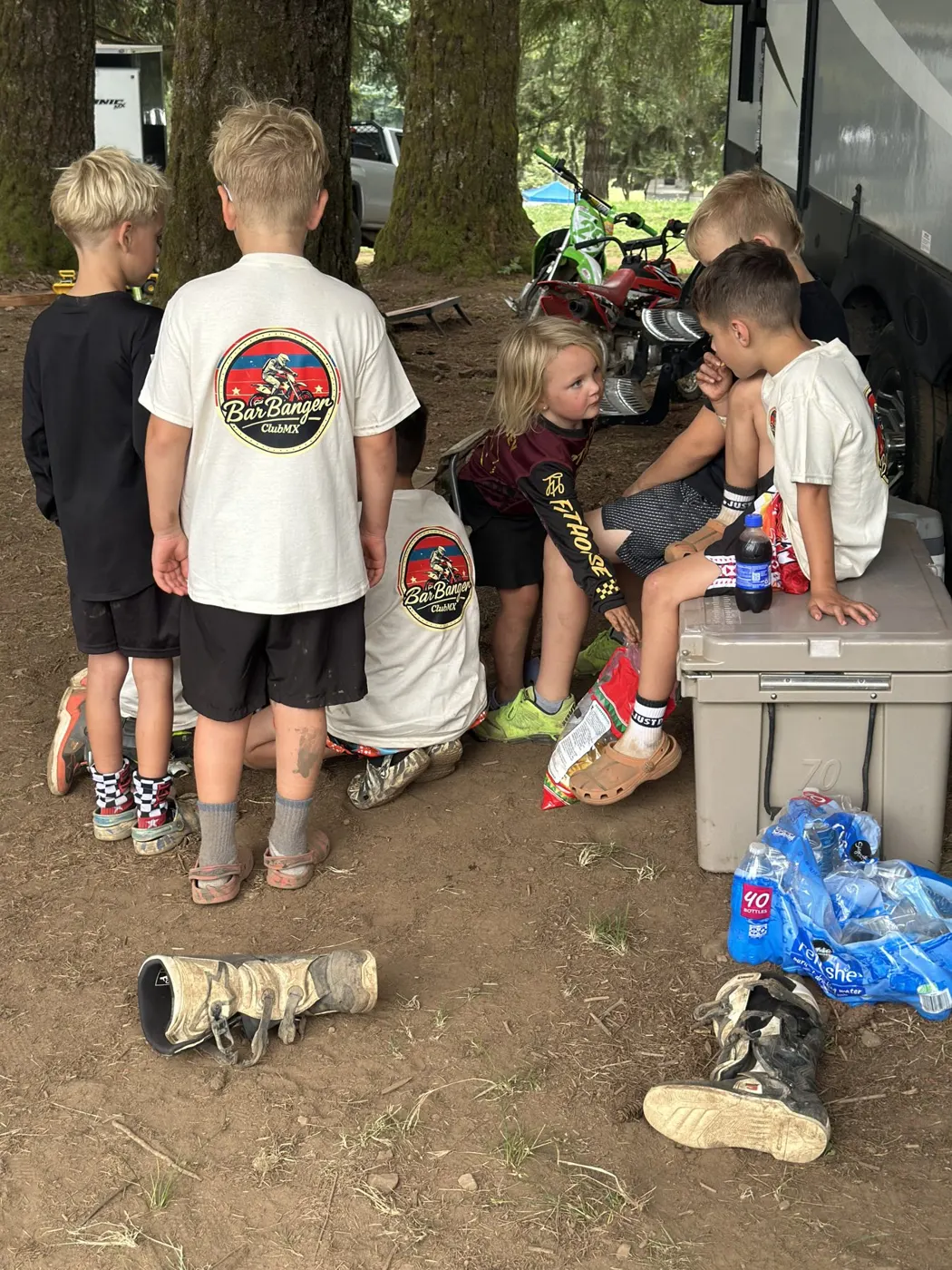 Club members in matching BarBanger tees at the trailer