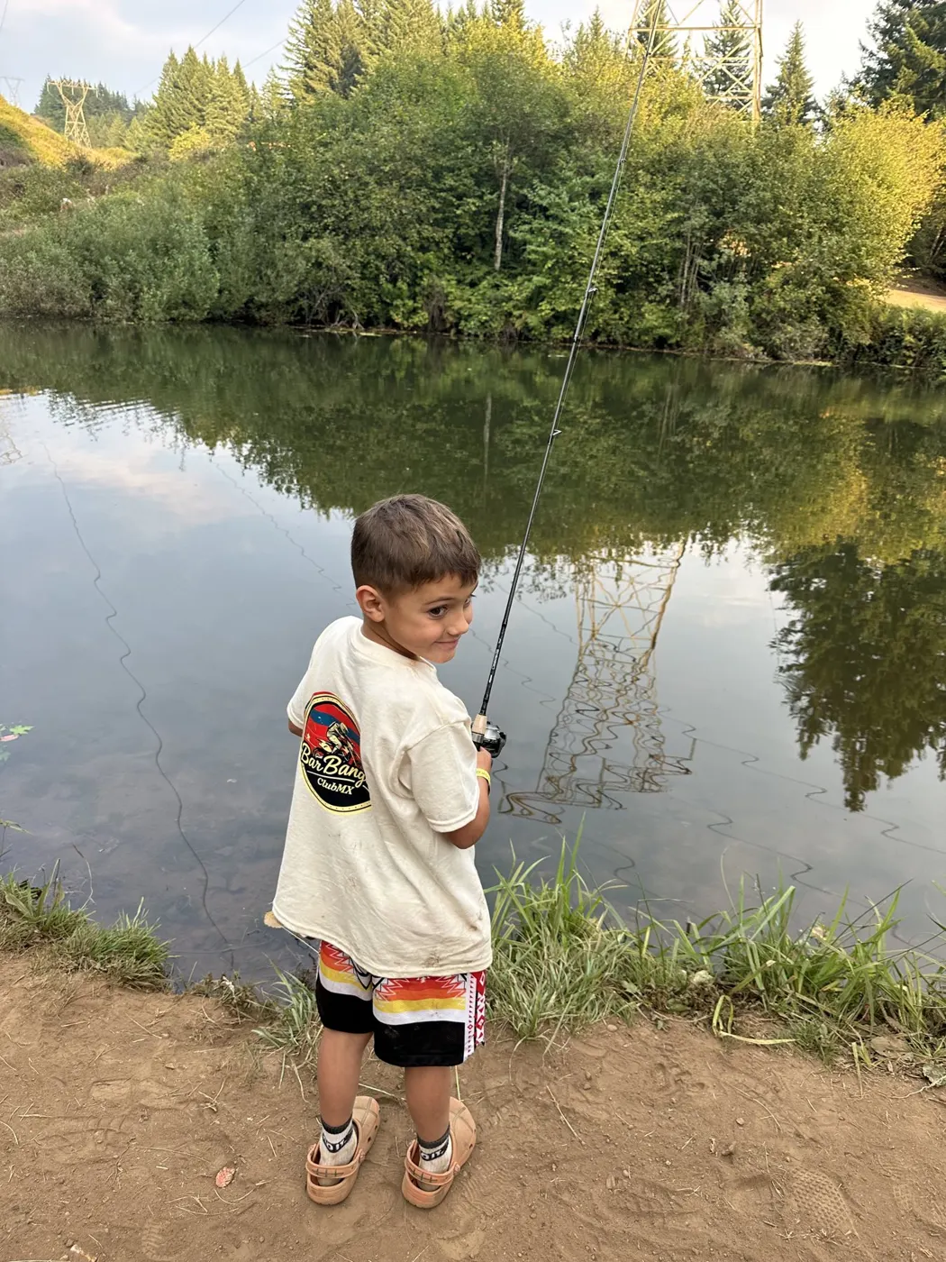 Club rider fishing in a BarBanger tee